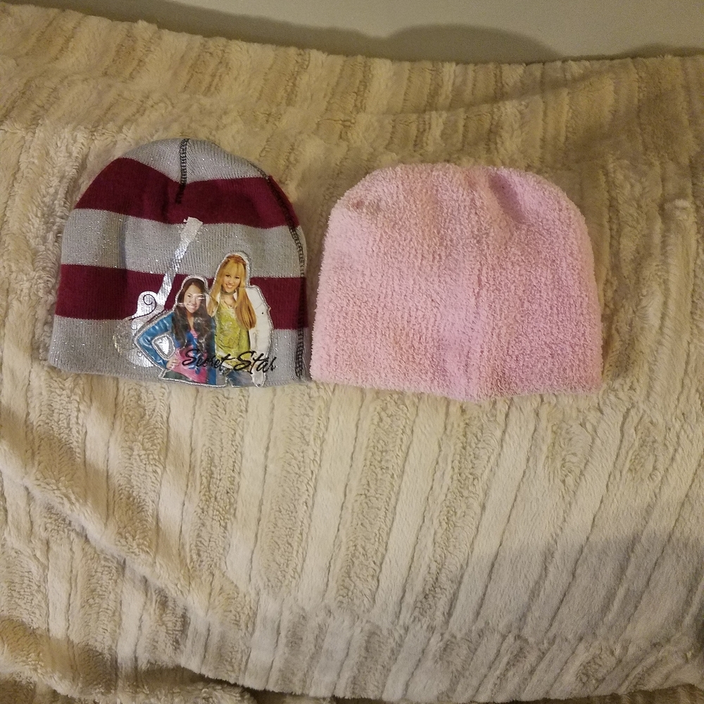 Pink beanie and Hannah Montana beanie